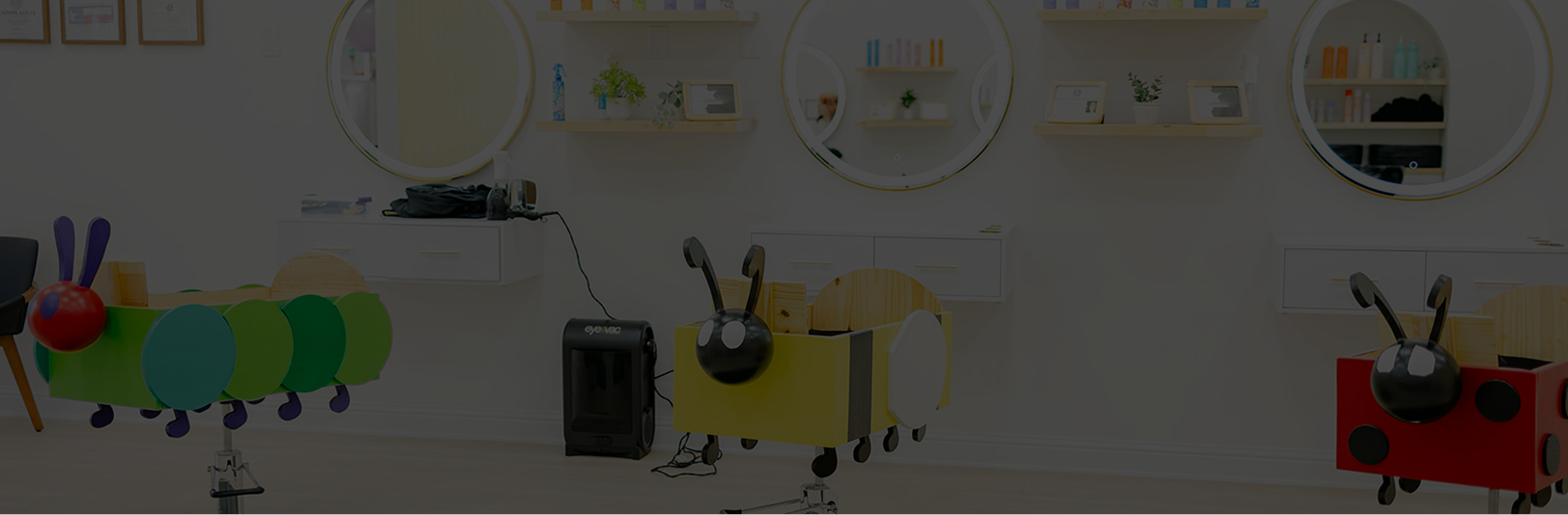 Children's room with educational toys shaped like caterpillars and a robot on a white wall.